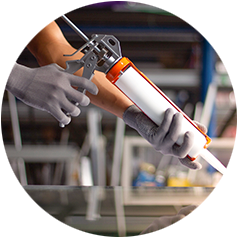 Caulk being applied to a surface